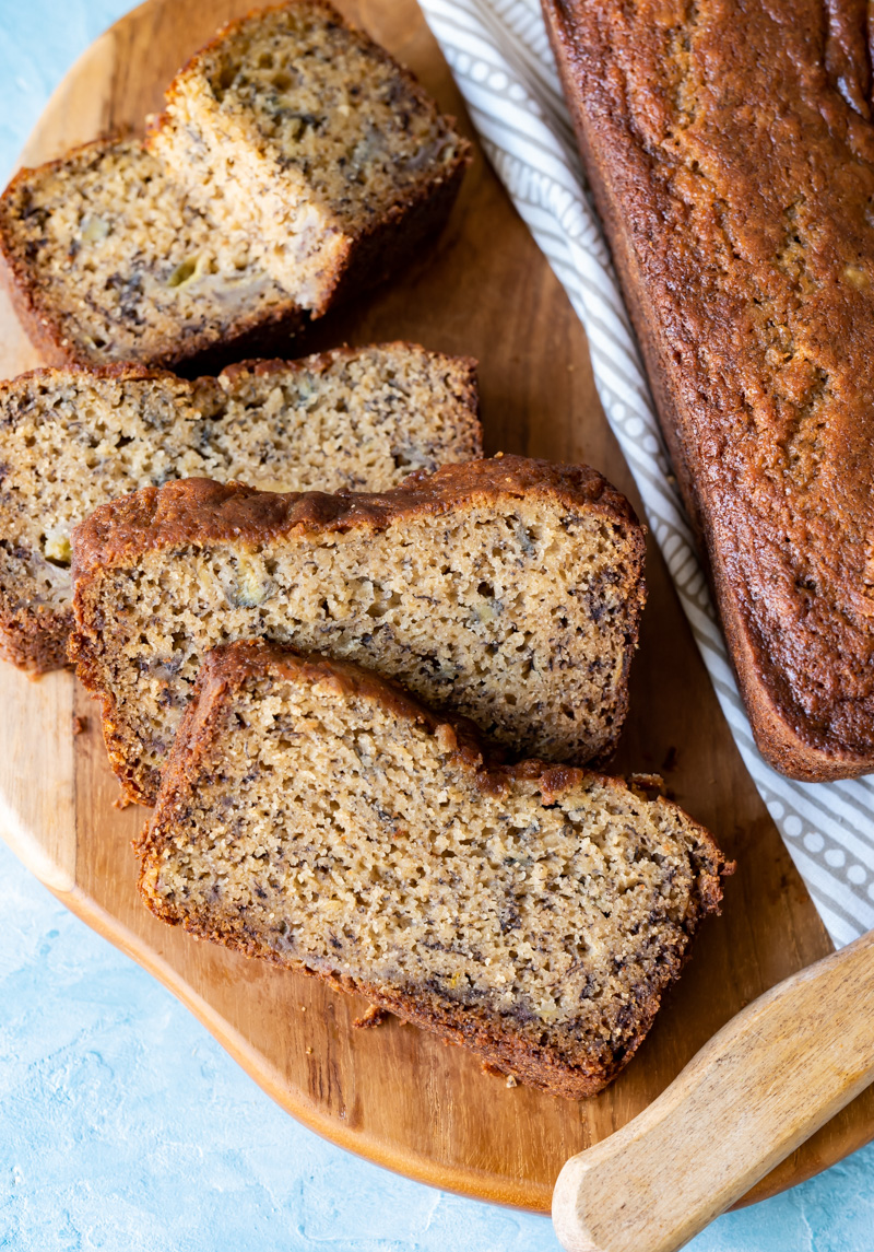 slices of banana bread on a wood cutting board