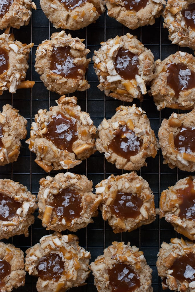 pretzel thumbprint cookies filled with caramel sprinkled with salt