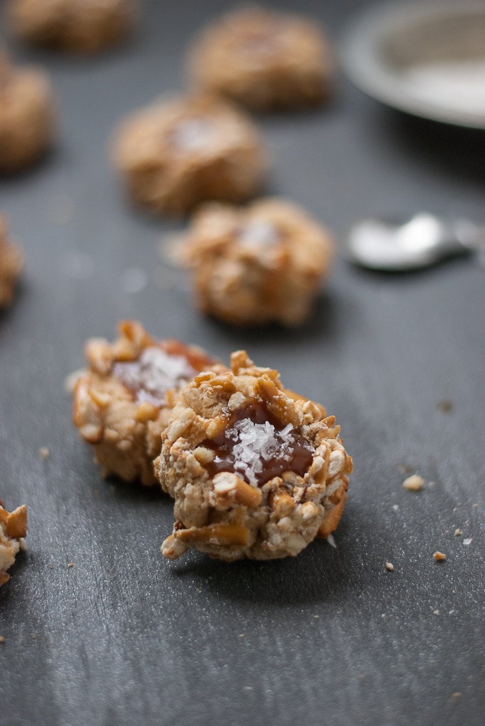 pretzel thumbprint cookies filled with caramel sprinkled with salt