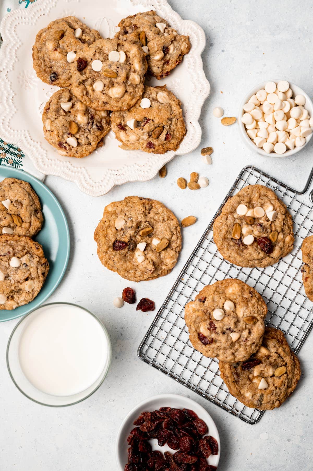 oatmeal cookies on various plates and wire racks glass of milk