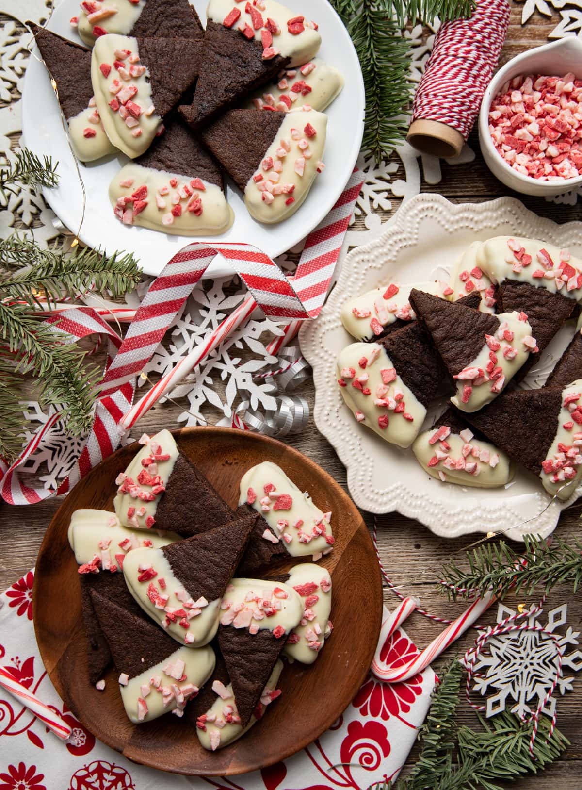 chocolate wedge shortbread cookies half dipped in white chocolate sprinkled with peppermint bits