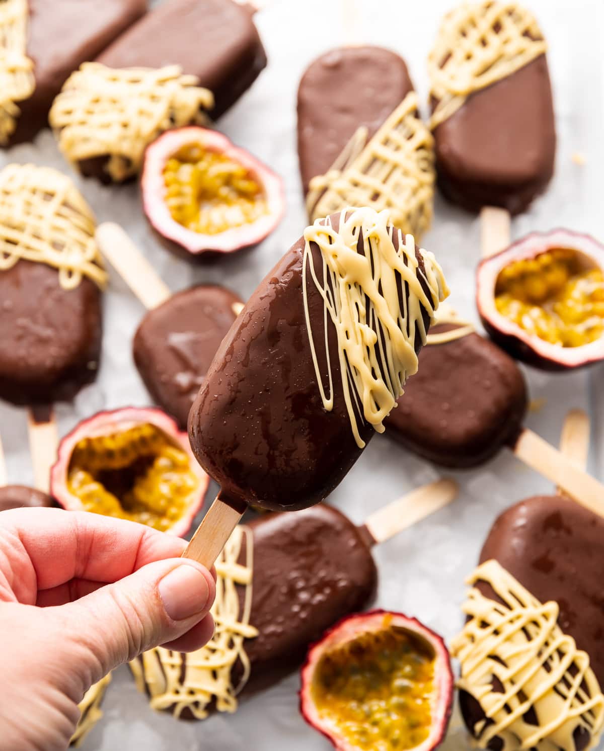 chocolate covered ice cream pops fresh passion fruits cut in half