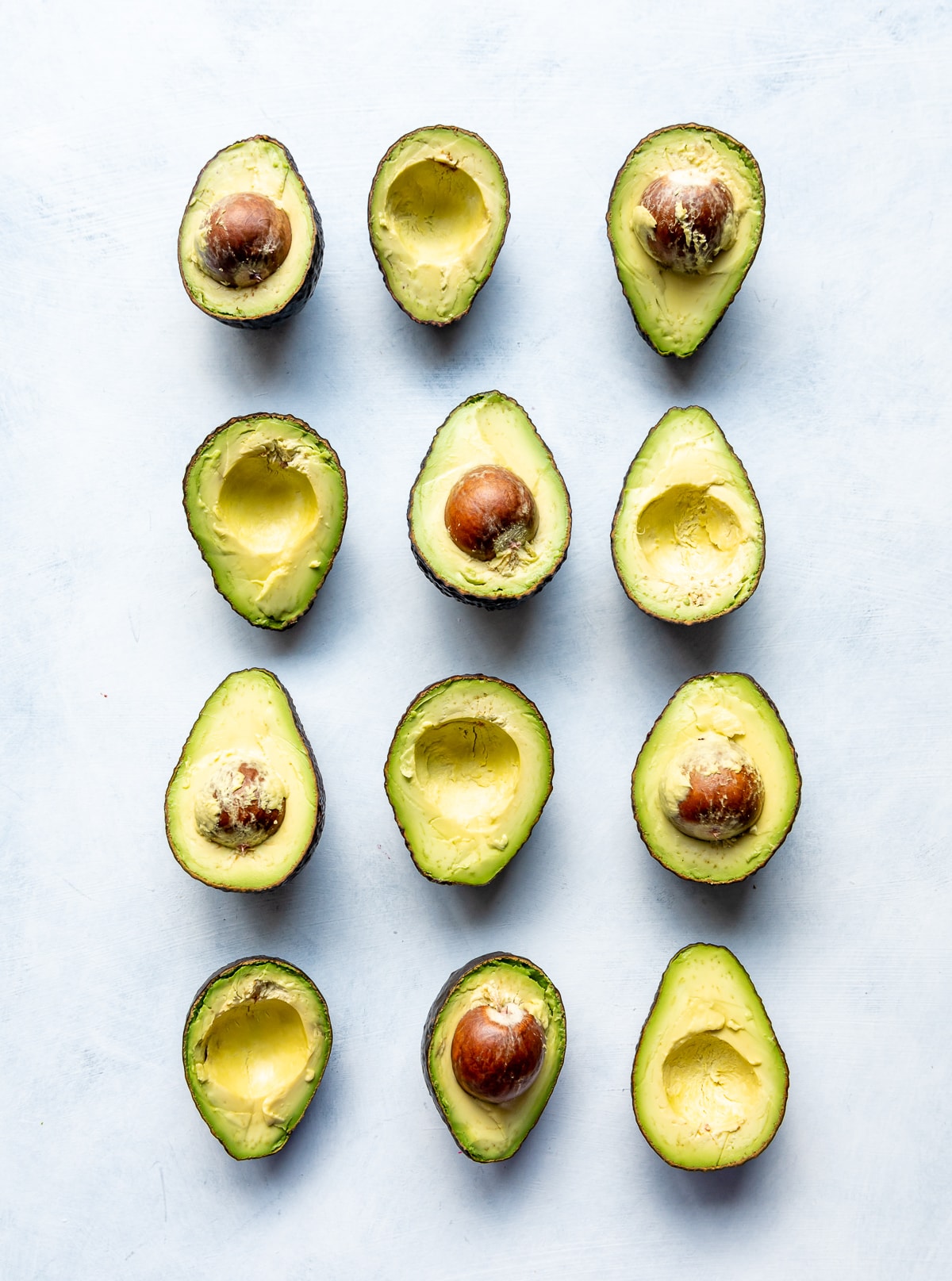 cut green avocado halves 