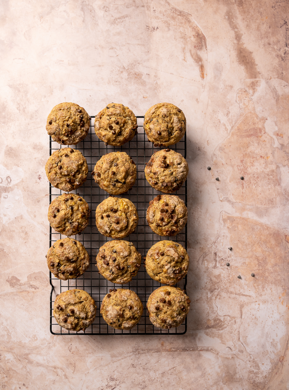 muffins with chocolate chips on a wire cooling rack