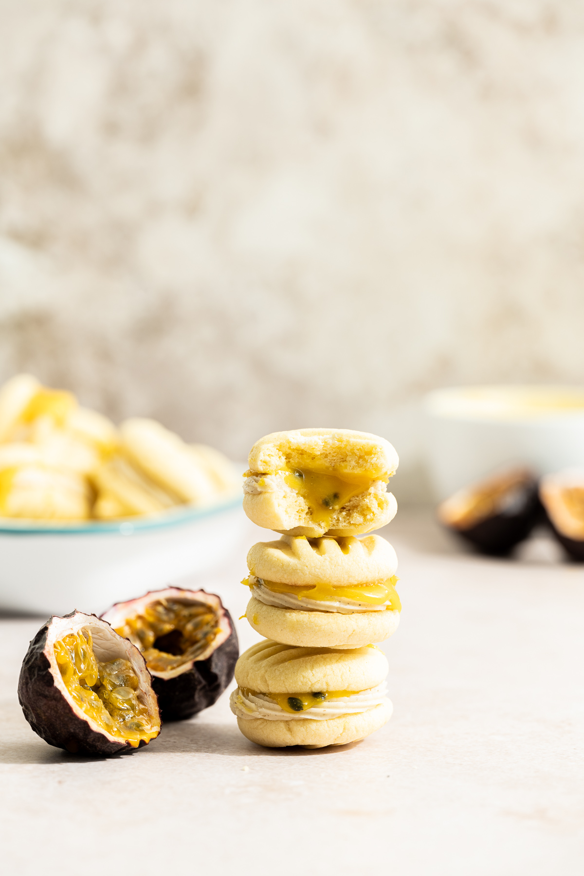 stack of passionfruit sandwich cookies passionfruit cut in half