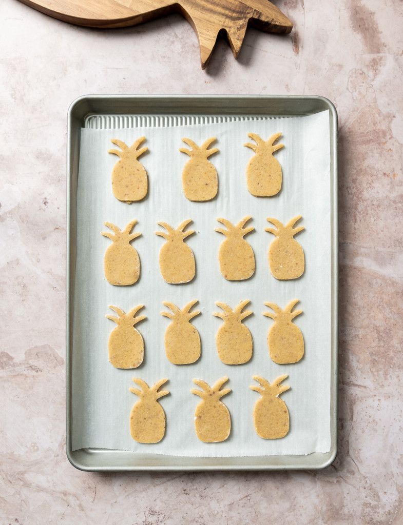 pineapple shaped cookies on a baking sheet