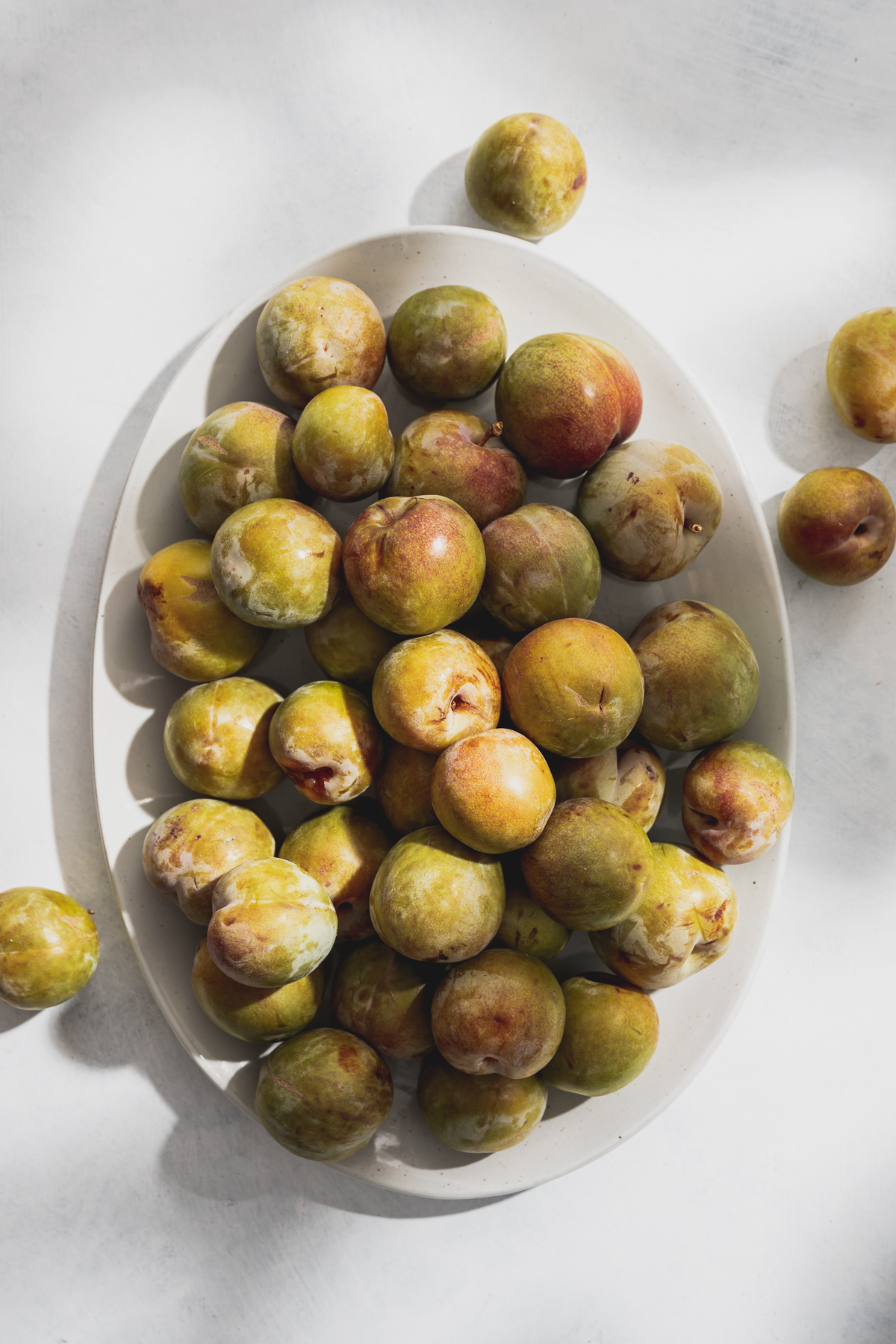 large platter of whole flavor queen plums