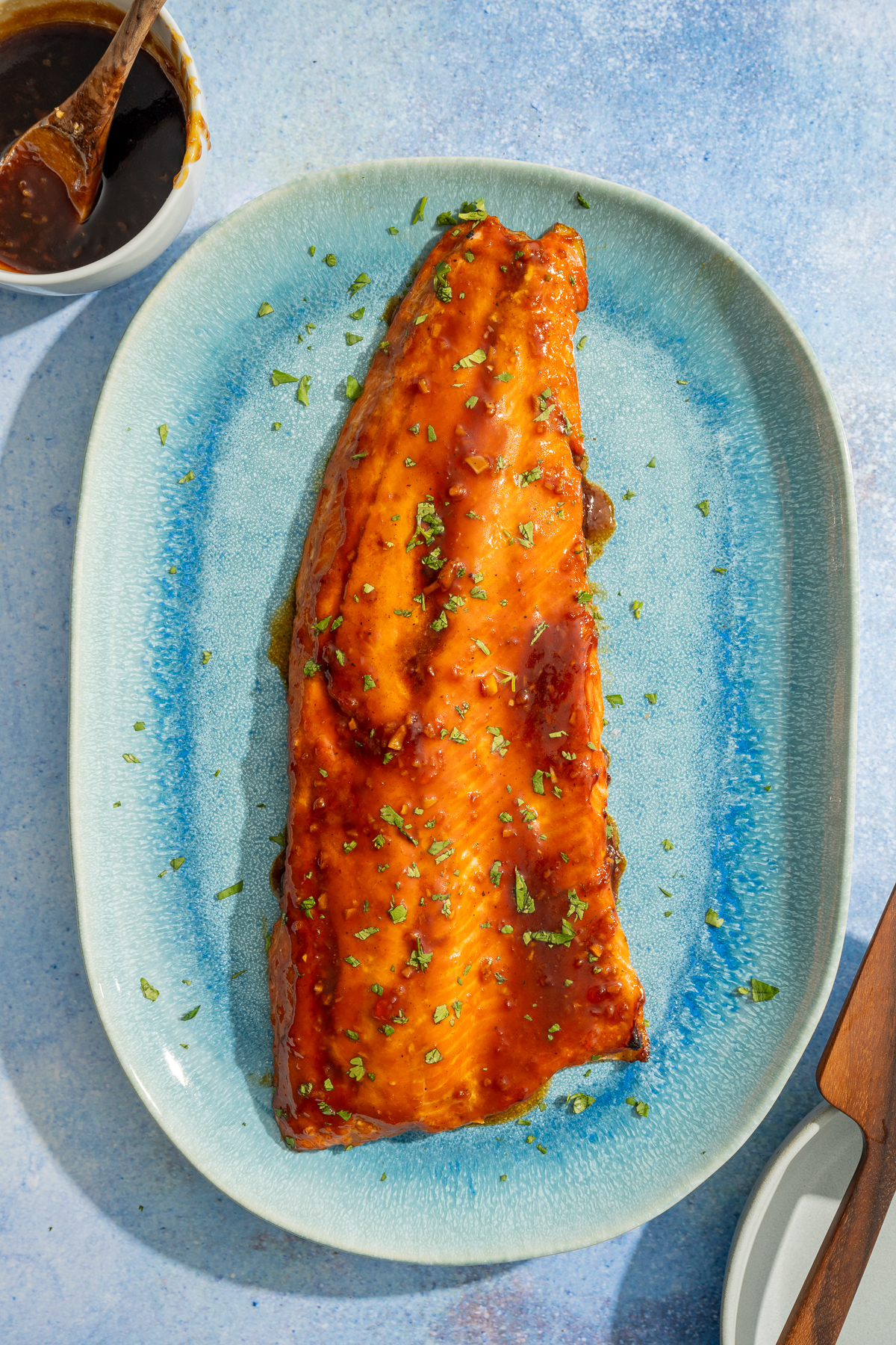 hot honey glazed salmon on blue platter