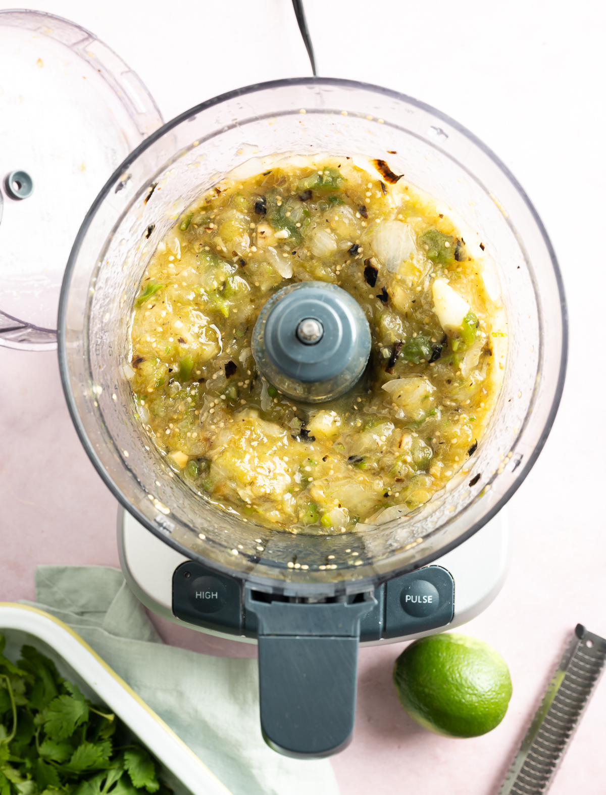 chunky pureed green salsa in food processor