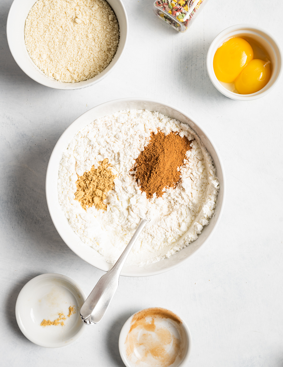 spices on top of a bowl of flour