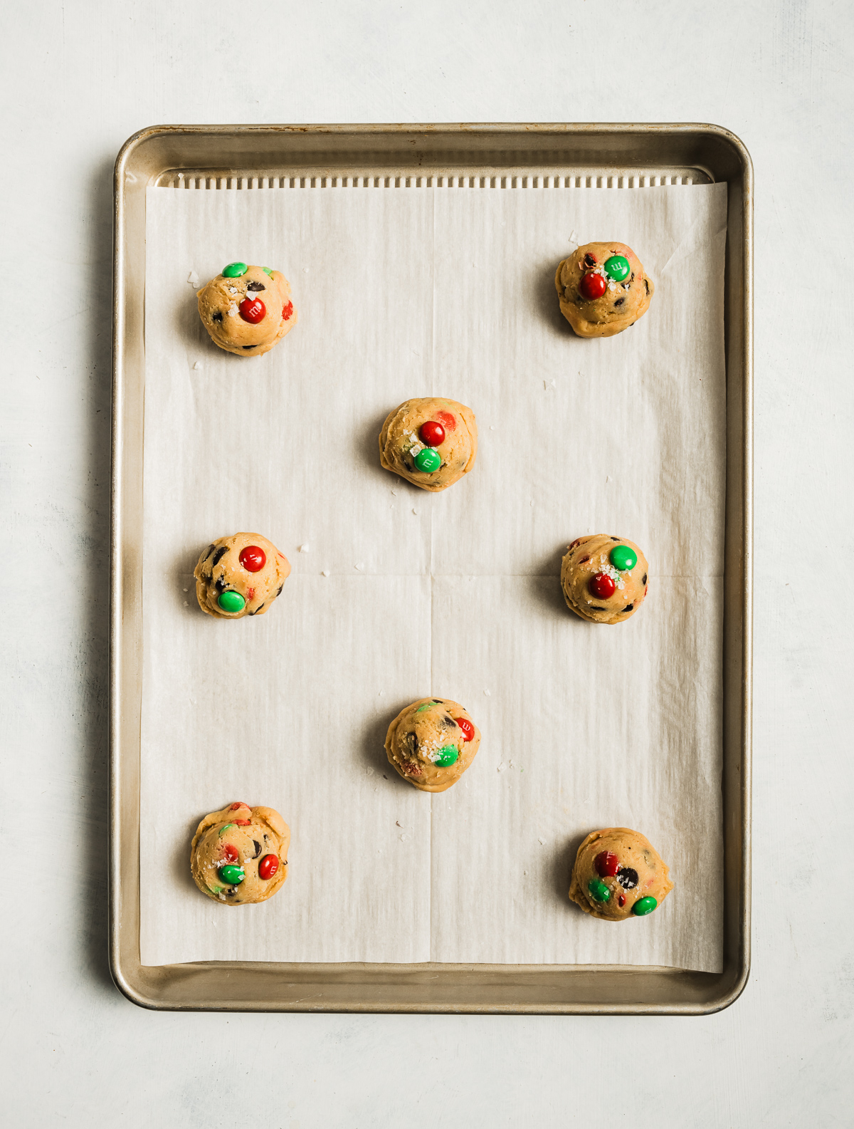 chocolate chip cookie dough balls on a baking shet