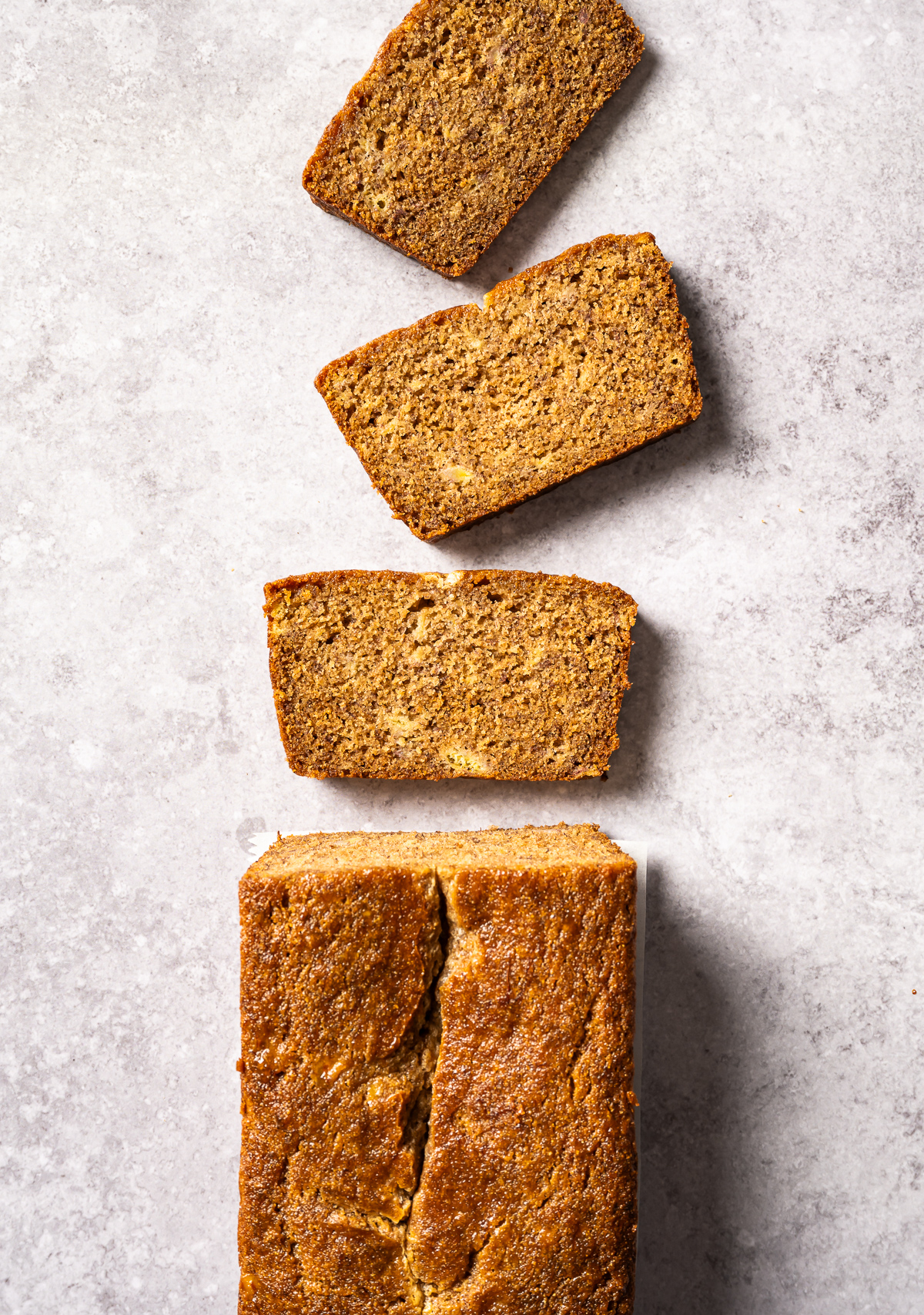 spelt banana bread loaf and three slices