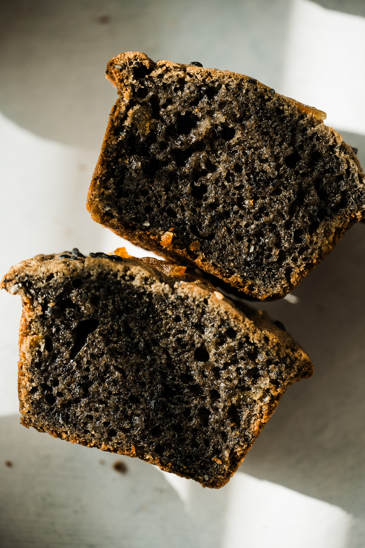 black sesame mochi muffin cut in half